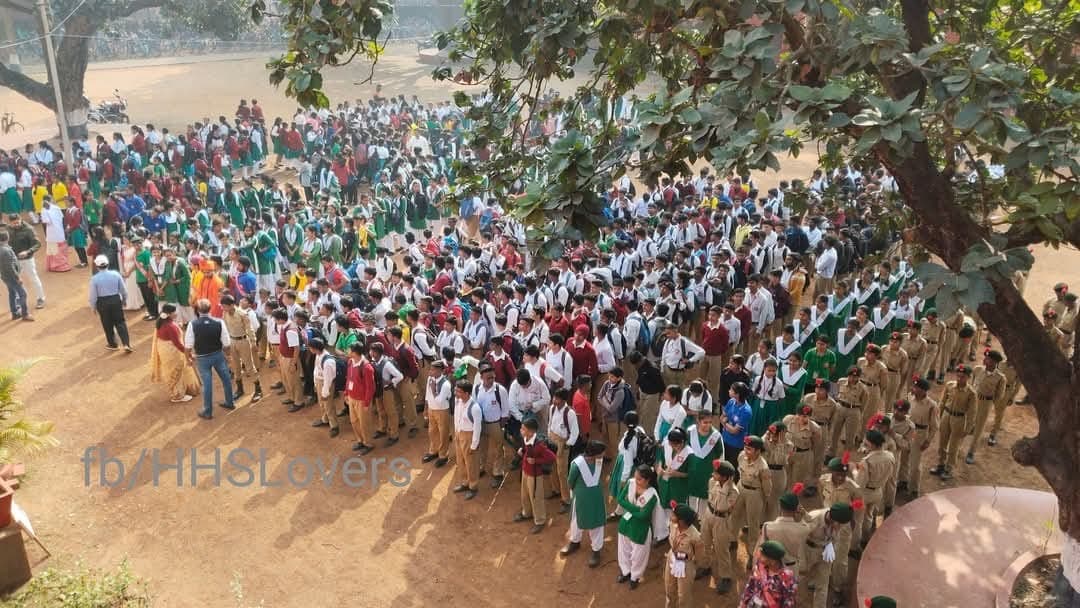 Aerial view of students assembled in the school grounds
