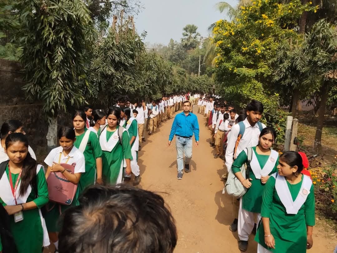 Students and teacher walking in procession