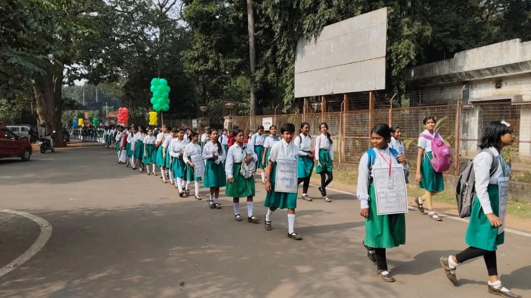 Students marching in rally with colourful balloons
